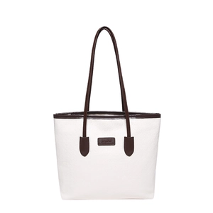 Minimalist white tote bag with dark brown leather trim and embossed texture detailing