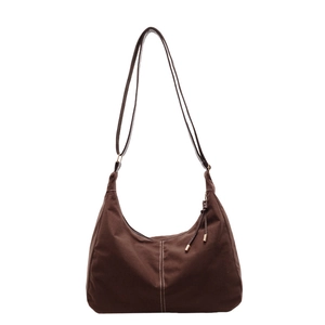 Klassieke bruine canvas hobo tas met witte stiksels en een lange schouderband