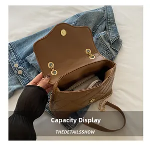 Brown quilted chain bag with open main compartment showing daily items inside
