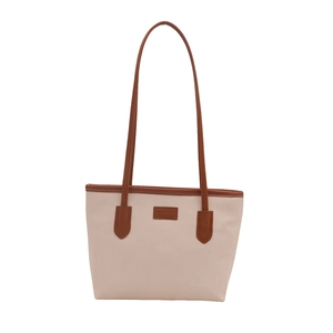 Minimalist large-capacity cream tote bag with brown leather trim and shoulder straps