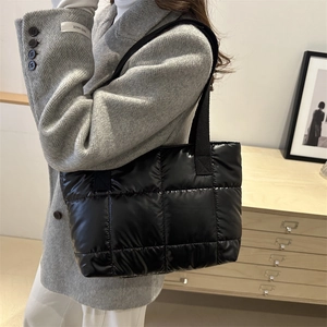 Chic black quilted puffer tote bag in soft space cotton for winter fashion shoulder wear