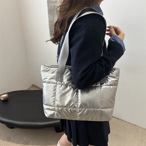 Silver quilted metallic puffer tote bag for women showing large capacity and winter fashion