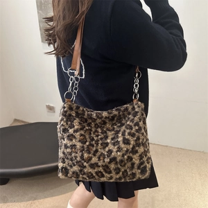 Stylish faux fur leopard print tote bag with brown leather strap and chain detail