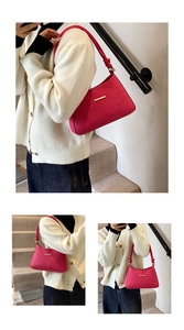 Detail of rose pink shoulder bag with lace floral embossing and gold metal fastener