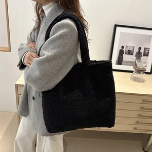 Winter black plush tote bag for women made of fluffy teddy fleece with broad strap