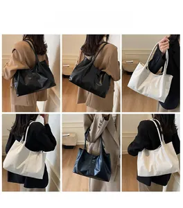 Detailed views of minimalist large capacity pleated tote bags in black and beige colors
