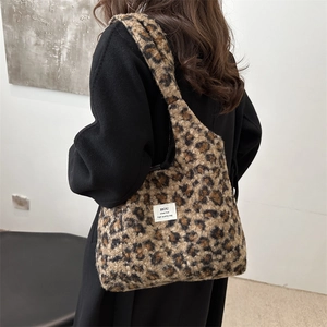 Fuzzy leopard print shoulder bag with plush texture and minimalist tote style