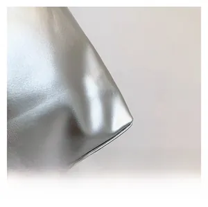 Detailed close-up showing high-quality silver metallic leather texture and fine stitching