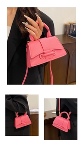 Detailed view of pink pebble leather mini handbag with stylish ring buckle decoration