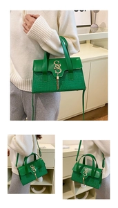 Green leather handbag with crocodile pattern and golden SS logo in three wearing styles