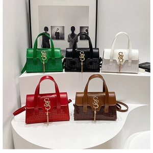 Crocodile pattern handbags with tassel and S-logo in green, black, white, red and coffee