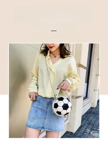 Detail of creative soccer shaped chain handbag with napa leather texture and star lock