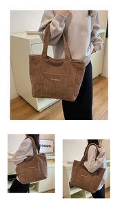 Detail view of brown corduroy tote bag showing textured fabric and Free Color embroidery