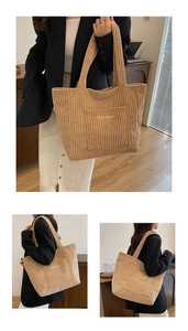 Detail of khaki corduroy tote bag featuring 'Free Color' embroidery and striped texture