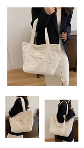 Close-up of beige corduroy tote bag featuring vertical ribs and embroidered front pocket
