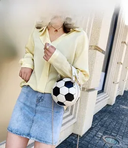 Detailed view of creative football-shaped handbag with golden chain strap and PU leather