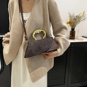 Dark brown crocodile pattern handbag with unique triangle design and gold metal handle