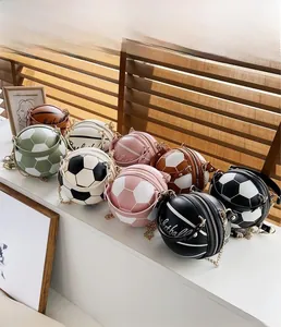 Detailed view of fashionable basketball and soccer shaped crossbody bags in various colors