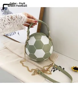Close-up of fruit green and white soccer-shaped handbag with a gold chain strap