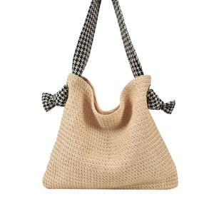 Handmade straw tote bag with houndstooth bow details and large capacity for beach