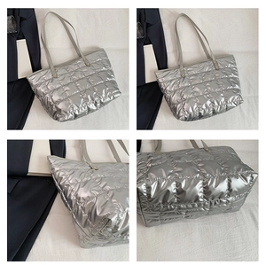 Detailed views of silver quilted tote bag with square stitching and metal rivets