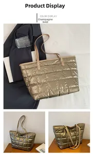 Detail of champagne gold quilted tote bag with metallic finish and leather handles