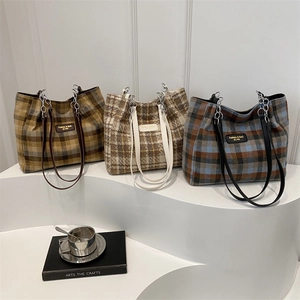 Three checkered plaid tote bags in various autumn colors with silver chain straps