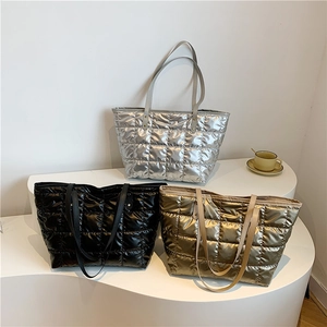 Quilted tote bags in silver, black, and gold with waterproof metallic finish