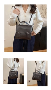 Detail view of dark brown British style satchel showing buckles and adjustable straps