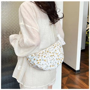 Floral canvas crescent bag with yellow prints and elegant lace straps for daily style