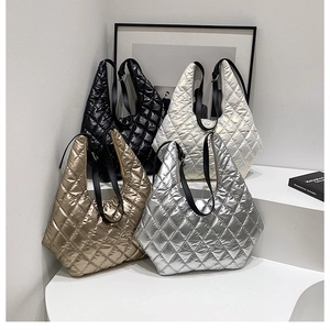 Detailed close-up showing quilted oversized tote bags in black, gold, cream and silver