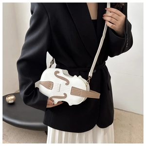 Detailed close-up of violin-shaped crossbody bag with white PU leather and brown details
