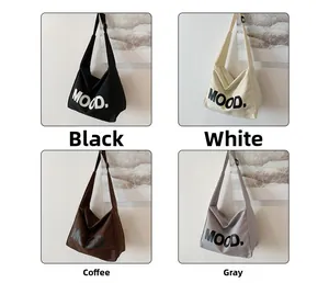 Detailed grid view showing four colors of canvas tote bags with MOOD print and wide straps