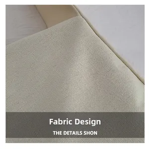 Close-up detail of off-white canvas fabric texture and neat stitching on a shoulder bag