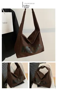 Detail view of large coffee canvas hobo bag with MOOD letter print and zipper closure