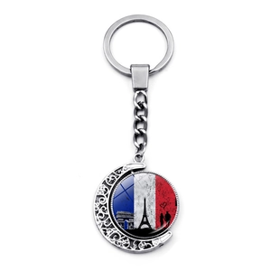 Llavero giratorio Torre Eiffel con bandera francesa en marco de luna creciente