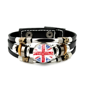 Macro detail of multi-layer leather bracelet with London Big Ben and Union Jack motif