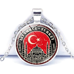 Detailed close-up of Istanbul Turkey souvenir necklace with flag and mosque design