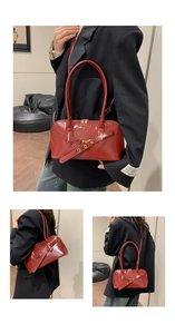 Three-way view of deep red oil wax leather handbag with gold hardware and strap details