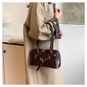 Chocolate brown vintage faux leather baguette bag with metal buckle and top handles