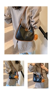 Detail of color-block shoulder bag with contrast trim and cute plush bear accessory