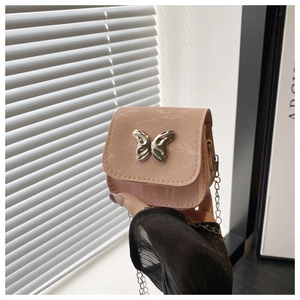 Detailed view of pink marble pattern mini bag with silver butterfly buckle and chain