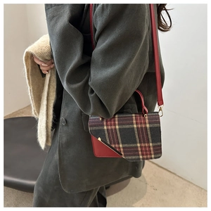 Retro plaid crossbody bag featuring red leather trim and gold metal closure detail