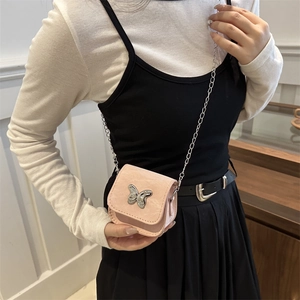 Pink mini crossbody bag with silver butterfly ornament and delicate metal chain strap