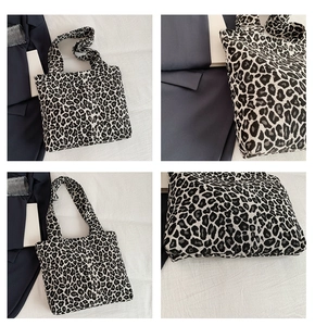 Detail view of stylish leopard print canvas tote bag with black and grey pattern