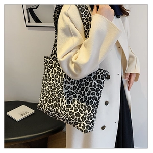 Detail of a large leopard print tote bag in black and white canvas for daily casual use