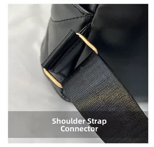 Detail of golden metal hardware connecting black nylon strap to vintage leather backpack