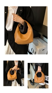 Close-up of brown woven hobo bag showing intricate texture and seamless handle