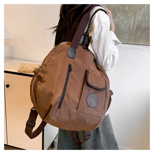 Detail of multi-pocket waterproof nylon backpack with side pockets and zip storage