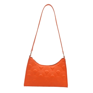 Chic orange crescent underarm bag with unique semi-circular quilted texture and slim strap